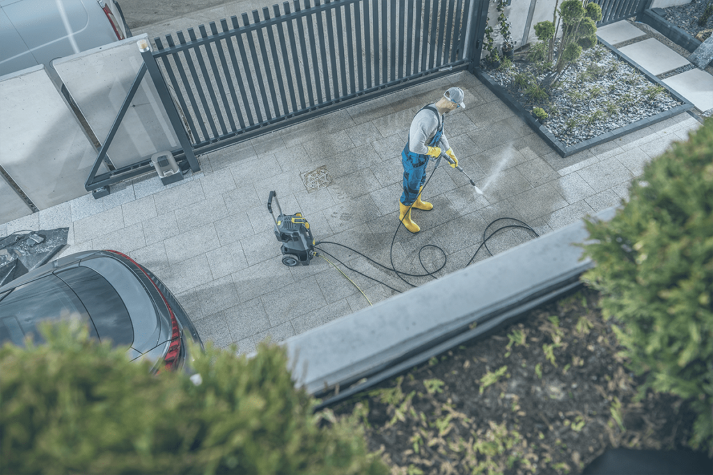 Cedar River Logistics & Contracting Pressure washing service professionally cleaning residential driveway in Kitchener, Ontario.